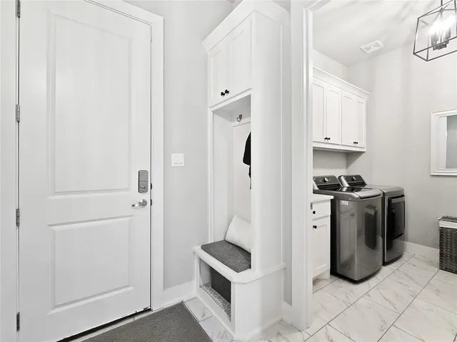 a kitchen with stainless steel appliances granite countertop a refrigerator and a stove