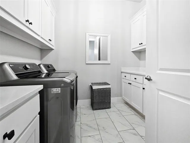 a view of an entryway with cabinet