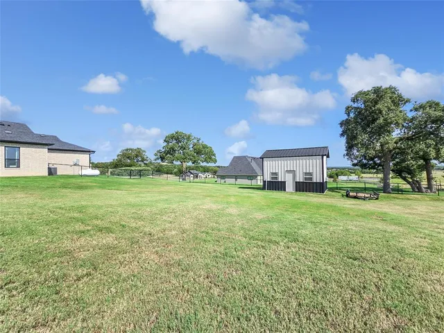 a view of a house with a big yard