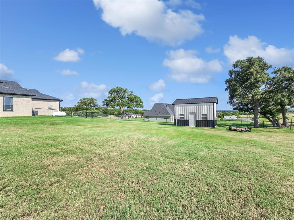 1008 Henry Way Springtown, TX 76082 - Photo 39 of 40 a view of a house with a big yard