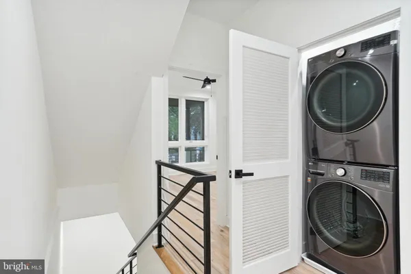 a view of a hallway with washer and dryer