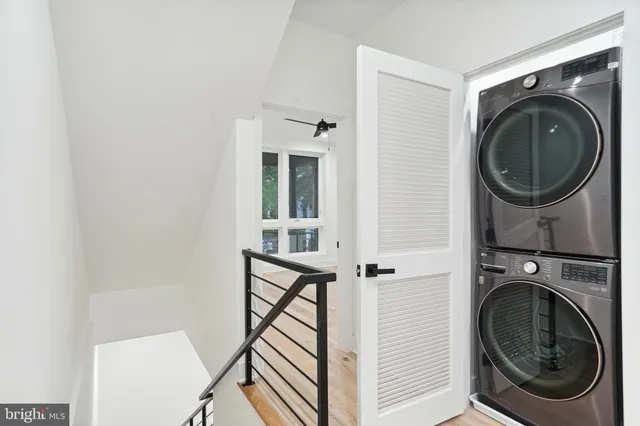 a view of a hallway with washer and dryer