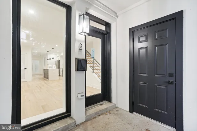 a view of a bathroom with a glass door shower and a sink