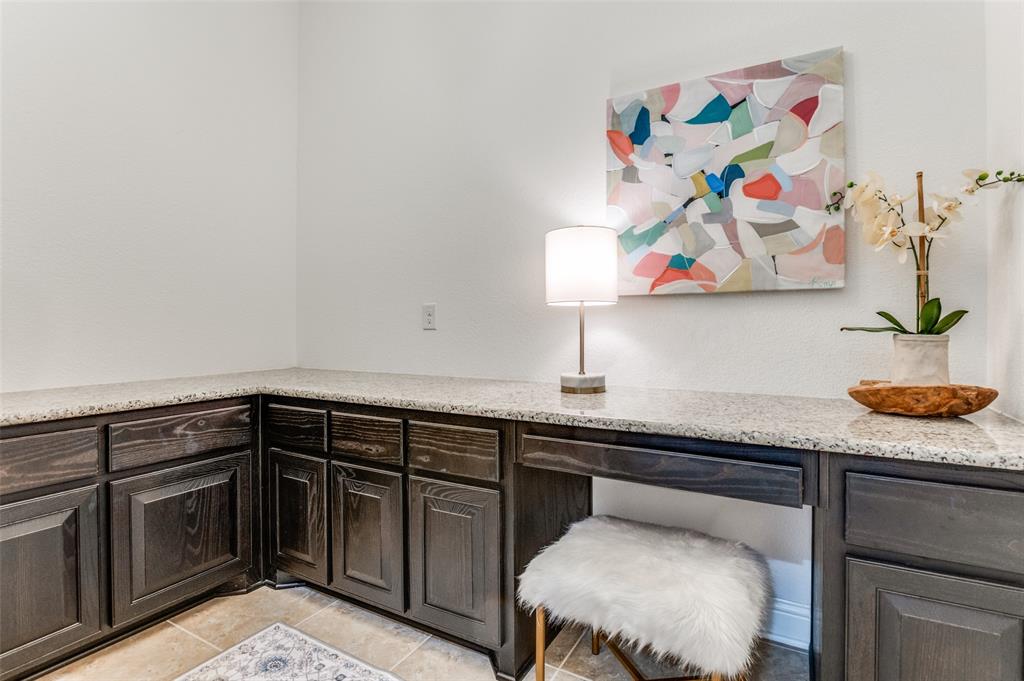 6809 Strauss Colleyville, TX 76034 - Photo 15 of 39 a kitchen with a sink and cabinets