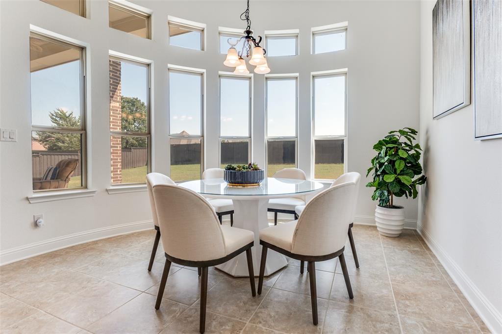 6809 Strauss Colleyville, TX 76034 - Photo 16 of 39 a view of a dining room with furniture and window