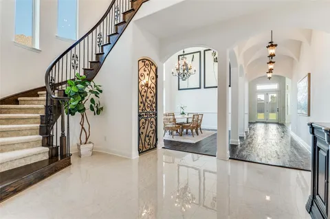 a view of staircase with furniture and a potted plant