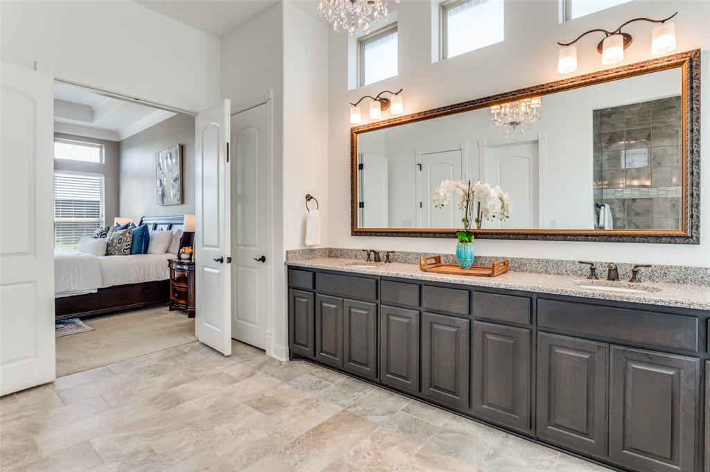 6809 Strauss Colleyville, TX 76034 - Photo 22 of 39 a spacious bathroom with a double vanity sink and a mirror