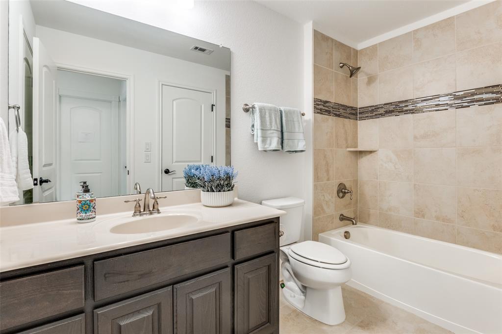 6809 Strauss Colleyville, TX 76034 - Photo 26 of 39 a bathroom with a sink a toilet and shower