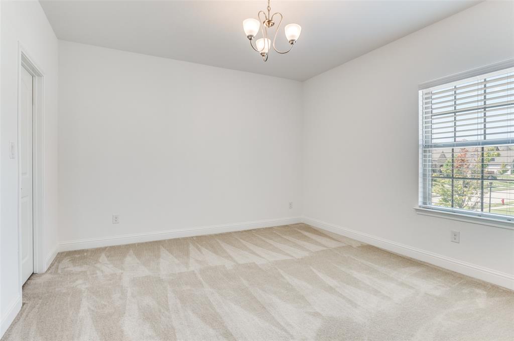 6809 Strauss Colleyville, TX 76034 - Photo 27 of 39 wooden floor in an empty room with a window