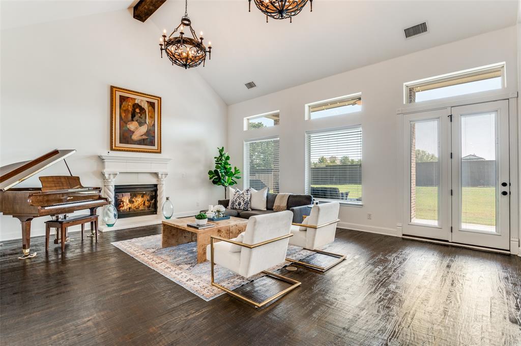 6809 Strauss Colleyville, TX 76034 - Photo 7 of 39 a living room with fireplace furniture and a wooden floor