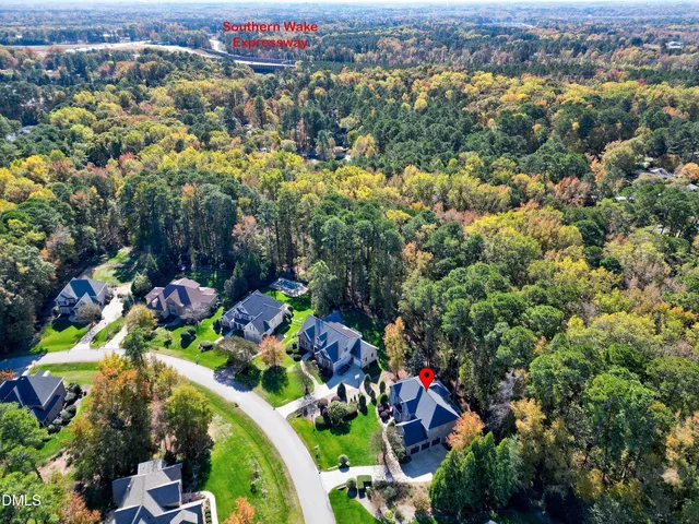 an aerial view of a houses with a street