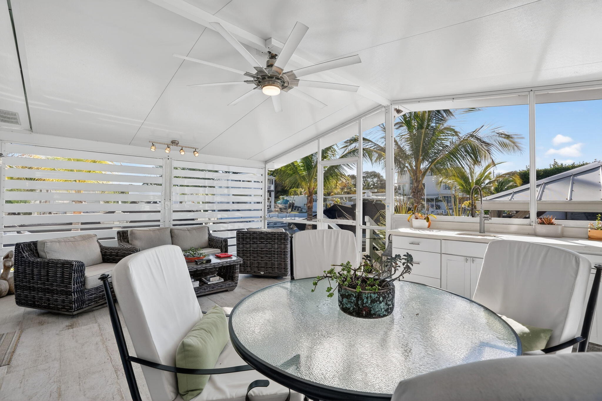 1127 Gulfstream Lane Key Largo, FL 33037 - Photo 21 of 40 a dining room with furniture and wooden floor