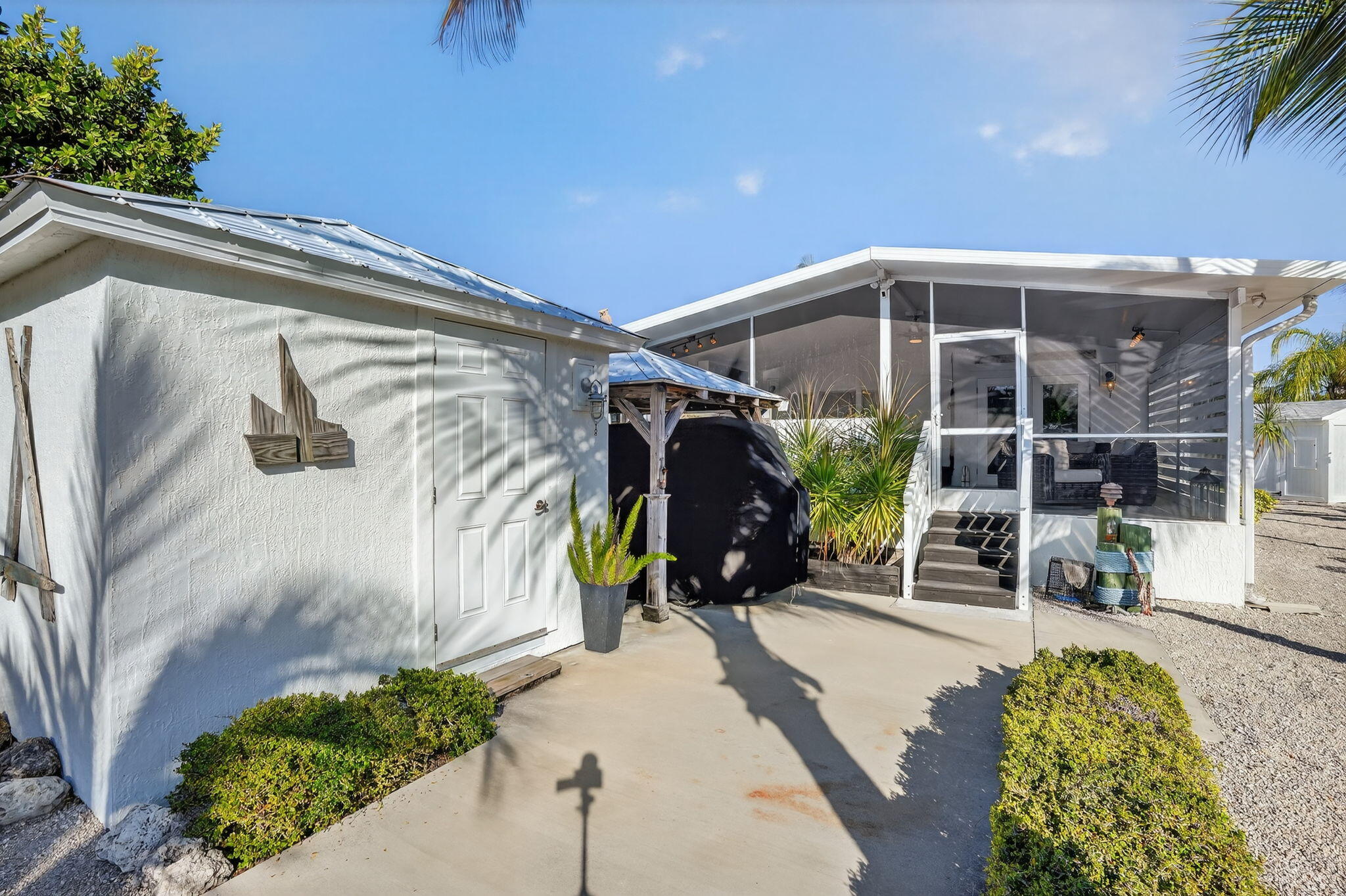1127 Gulfstream Lane Key Largo, FL 33037 - Photo 29 of 40 a front view of a house with a yard