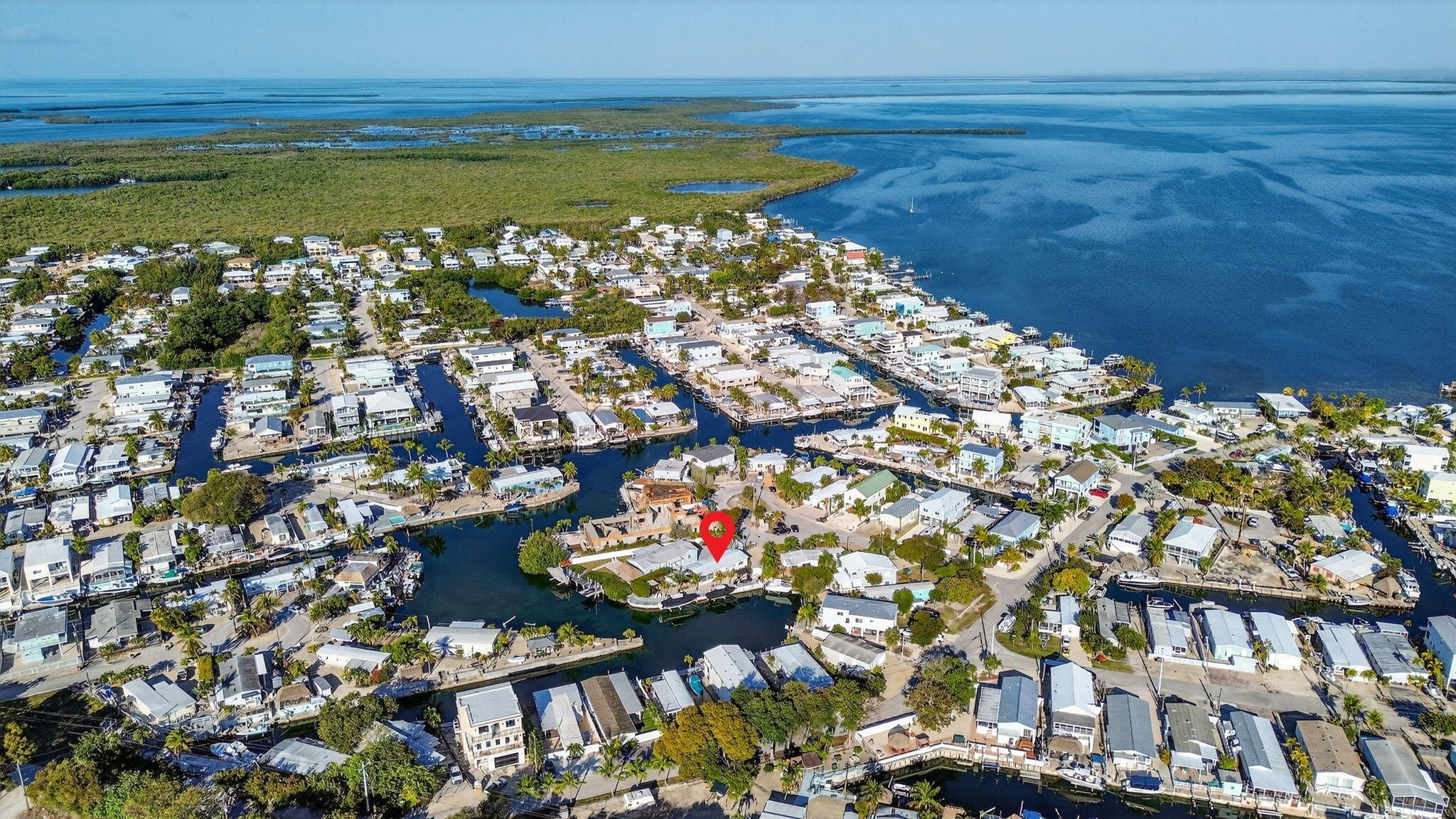 1127 Gulfstream Lane Key Largo, FL 33037 - Photo 35 of 40 a city view with tall buildings