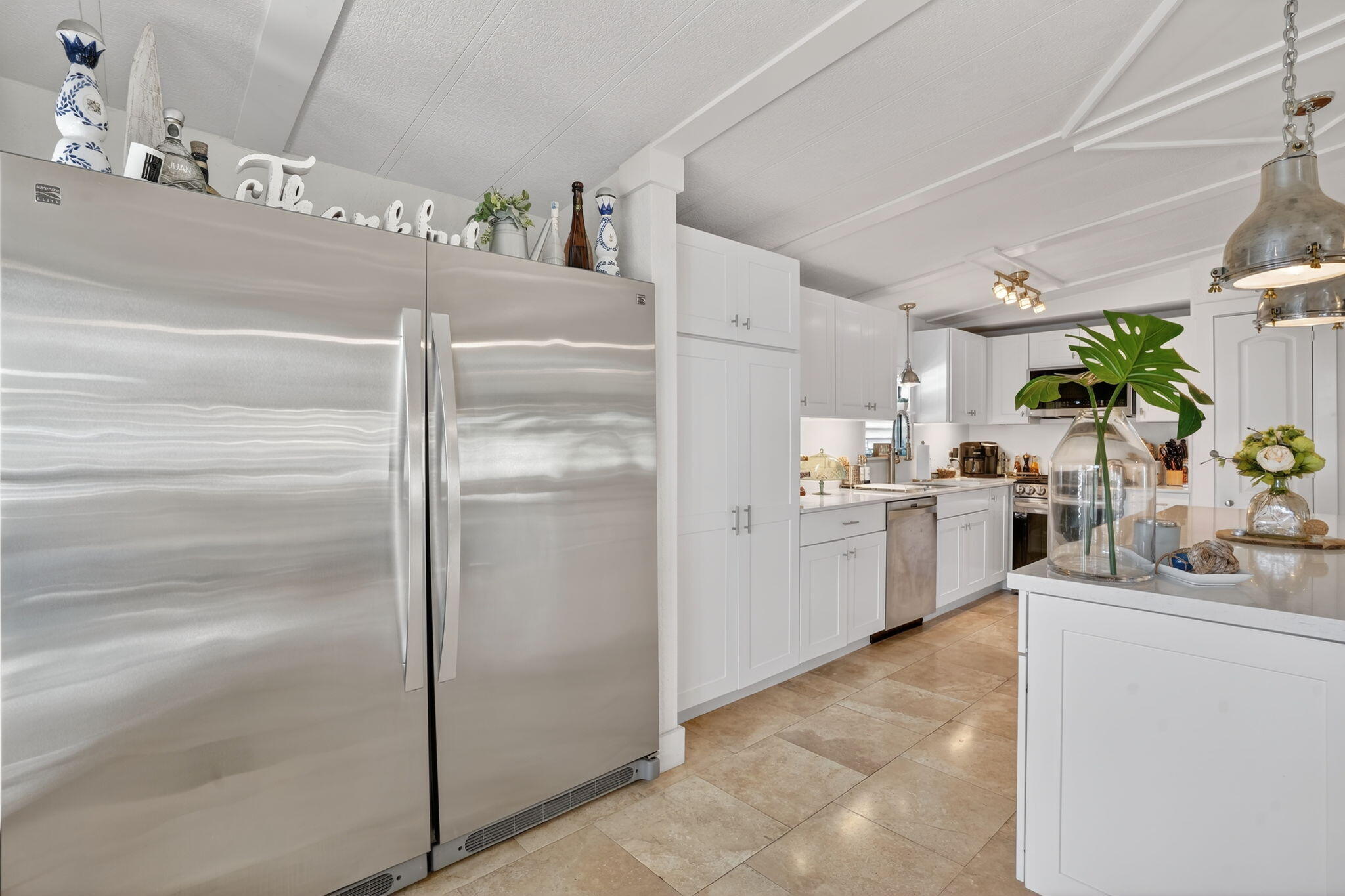 1127 Gulfstream Lane Key Largo, FL 33037 - Photo 8 of 40 a kitchen with a refrigerator and a sink