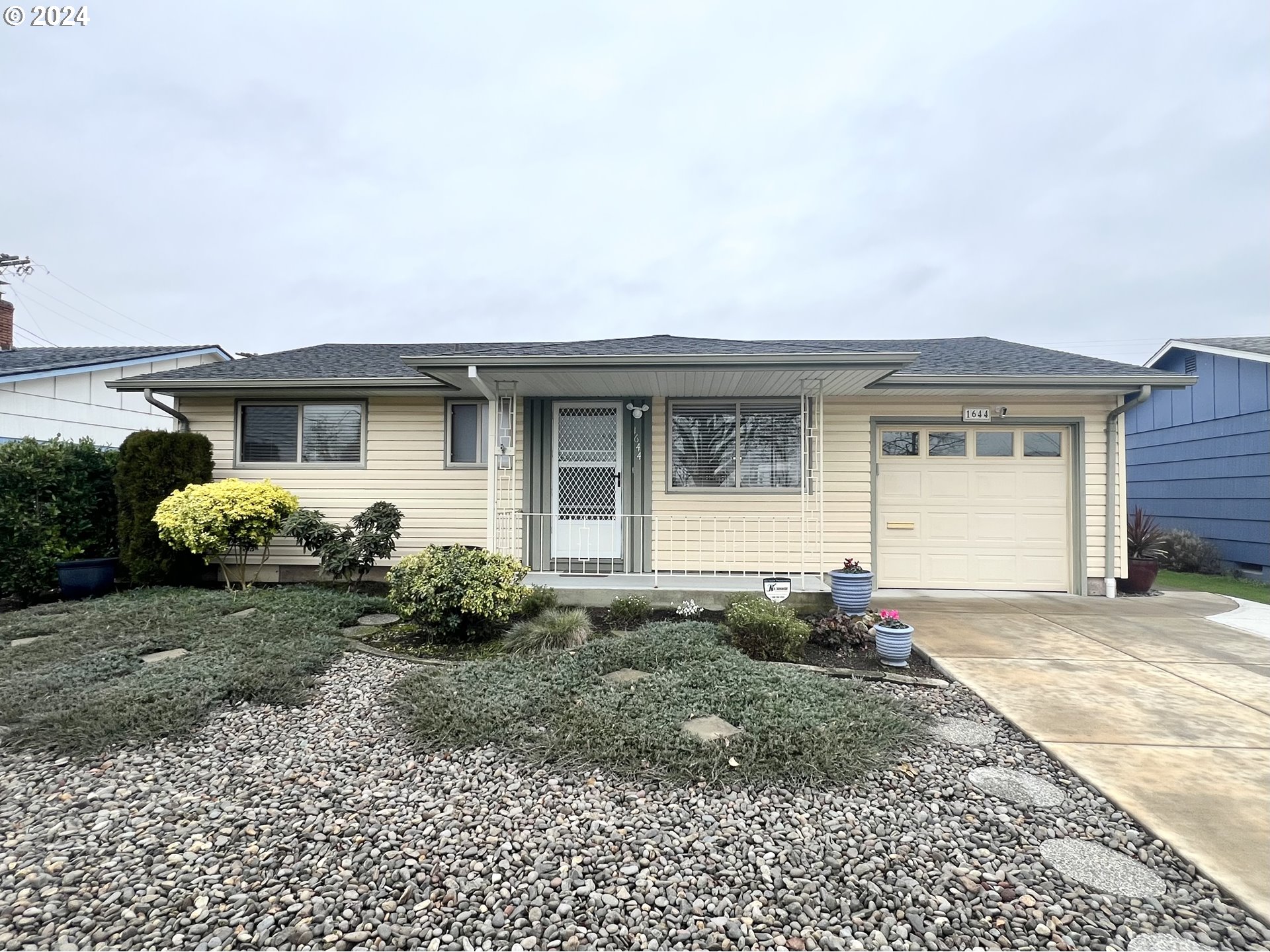 a front view of a house with garden