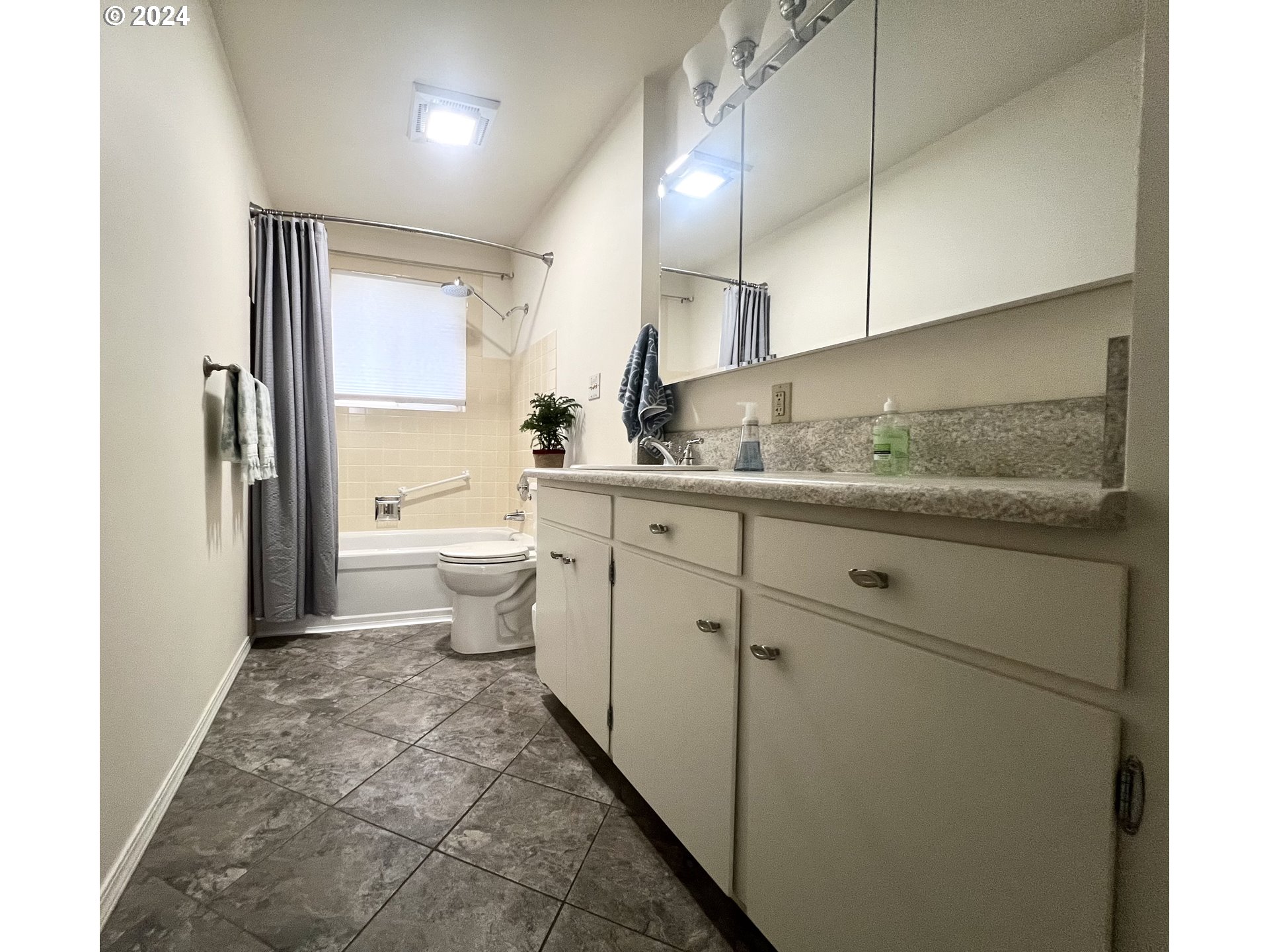 1644 Astor Way Woodburn, OR 97071 - Photo 13 of 28 a bathroom with a granite countertop sink a toilet and a mirror