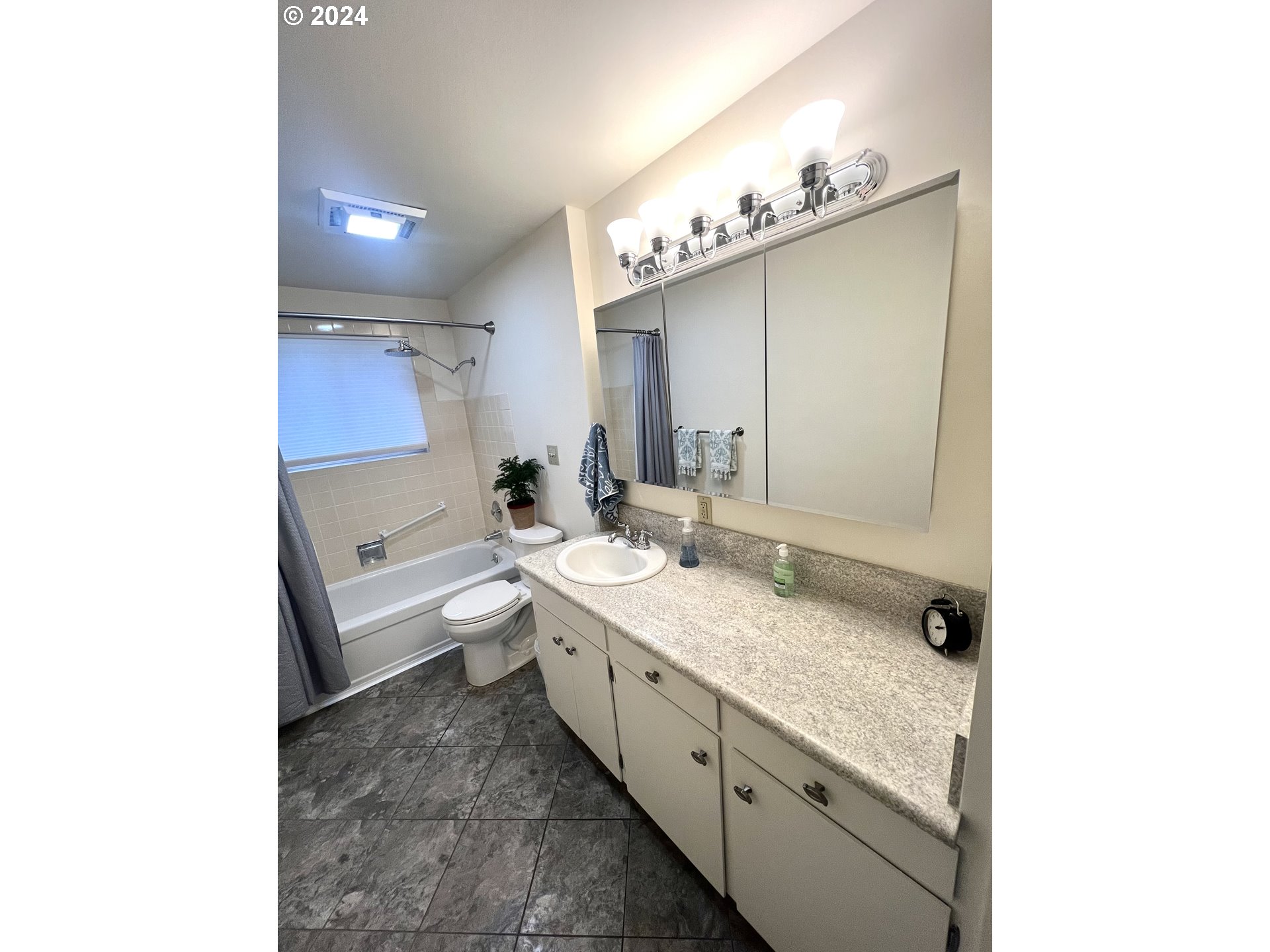 1644 Astor Way Woodburn, OR 97071 - Photo 14 of 28 a spacious bathroom with a granite countertop sink a toilet and a mirror