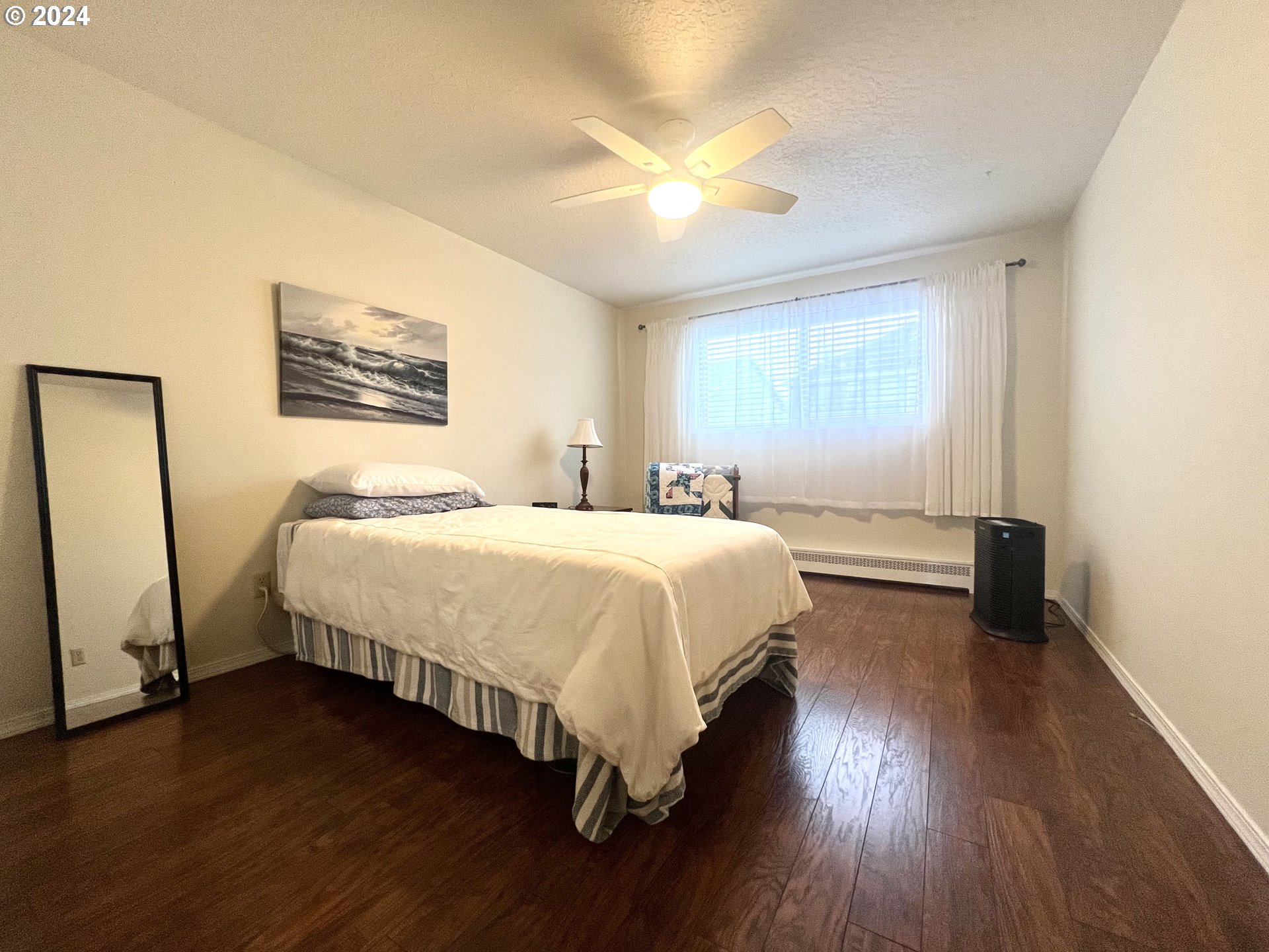 1644 Astor Way Woodburn, OR 97071 - Photo 16 of 28 a spacious bedroom with a bed and a table