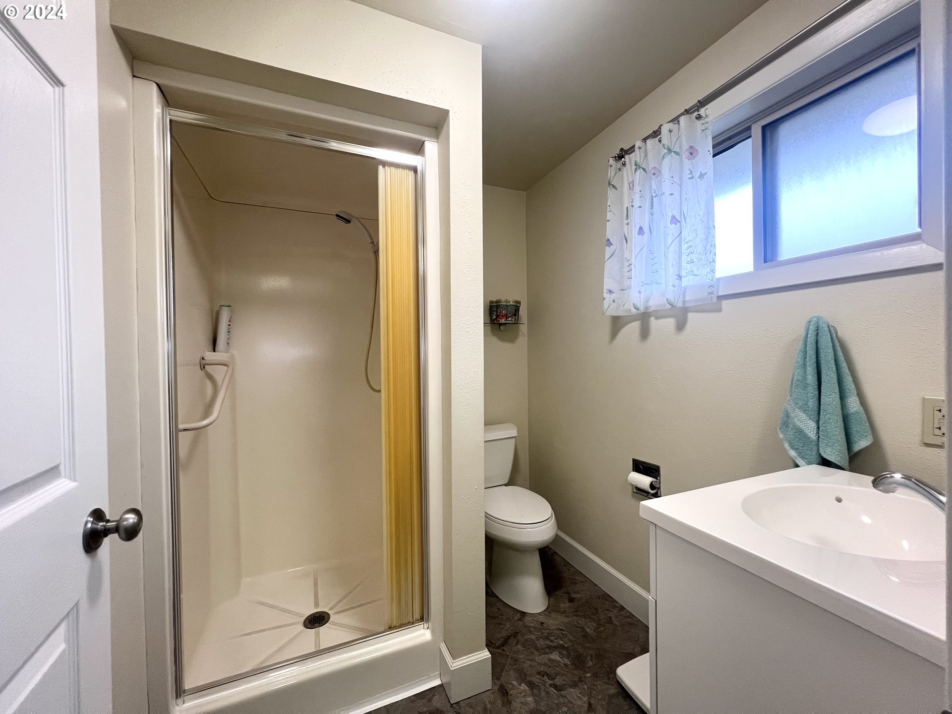 1644 Astor Way Woodburn, OR 97071 - Photo 19 of 28 a bathroom with a granite countertop toilet and a shower