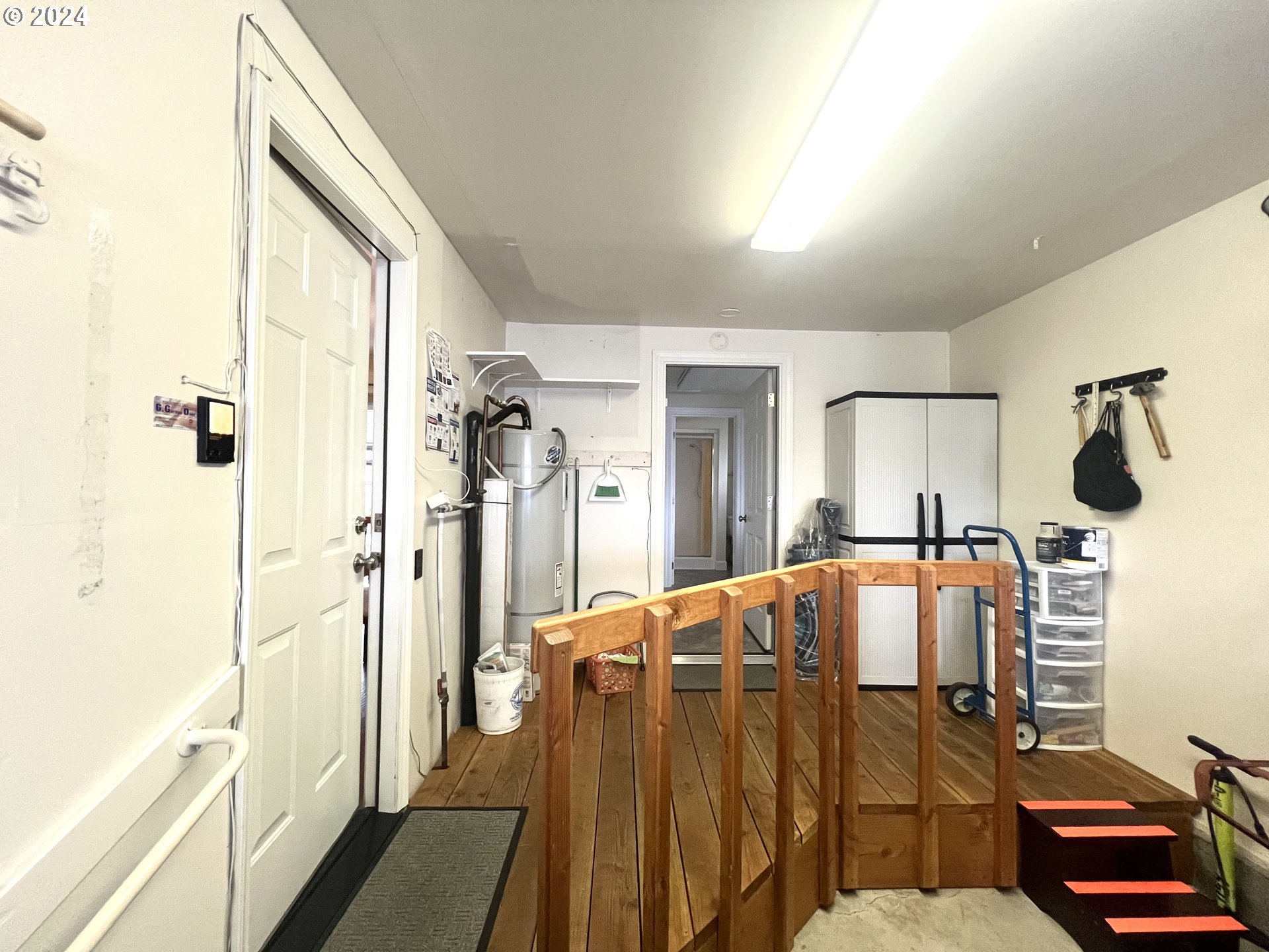 1644 Astor Way Woodburn, OR 97071 - Photo 23 of 28 a bedroom with a bed and wooden floor