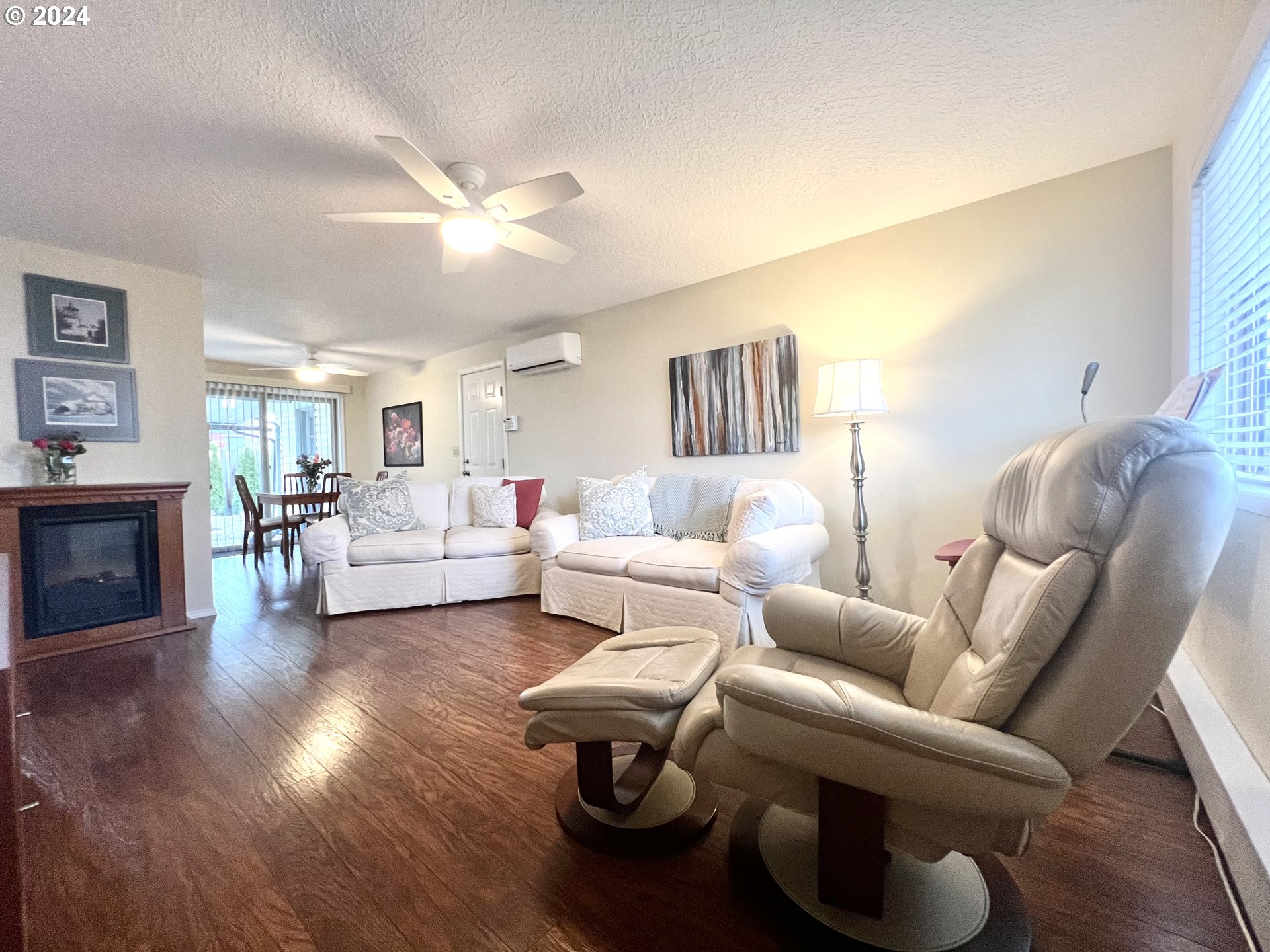 1644 Astor Way Woodburn, OR 97071 - Photo 5 of 28 a living room with furniture and a fireplace