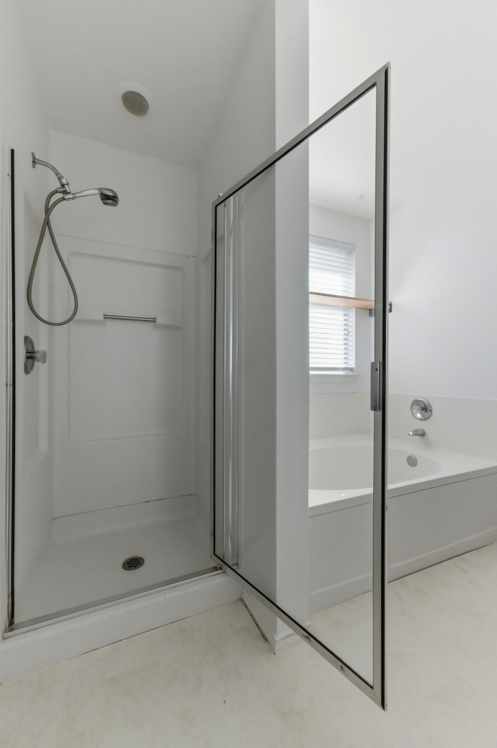 113 Spring Branch Cove Kyle, TX 78640 - Photo 17 of 33 Bathroom with a shower stall and a bath