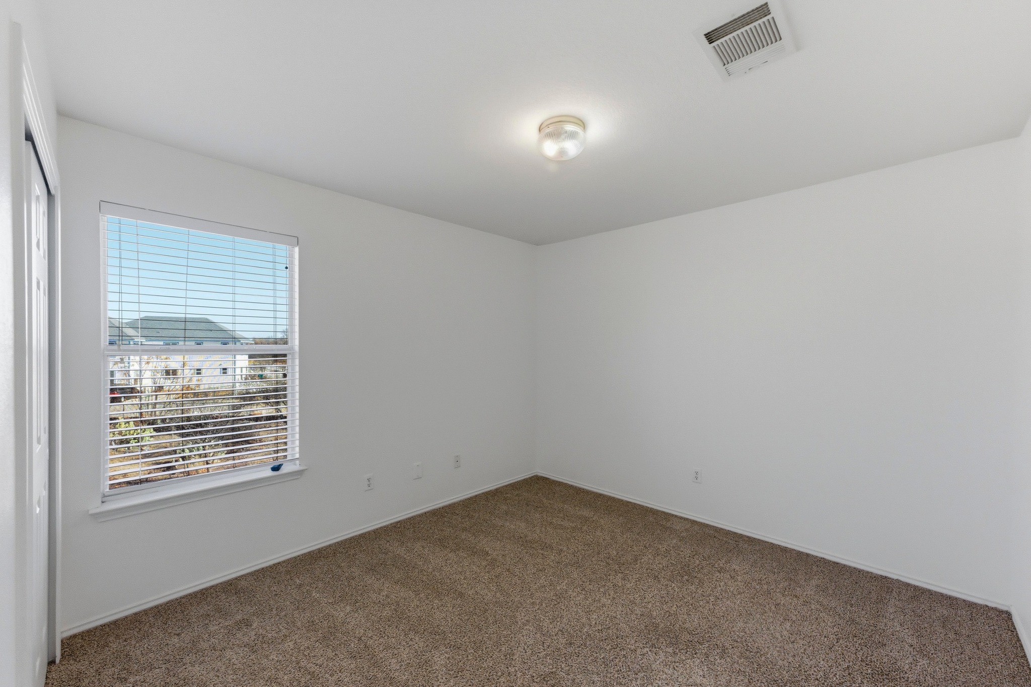 113 Spring Branch Cove Kyle, TX 78640 - Photo 25 of 33 Carpeted spare room with baseboards