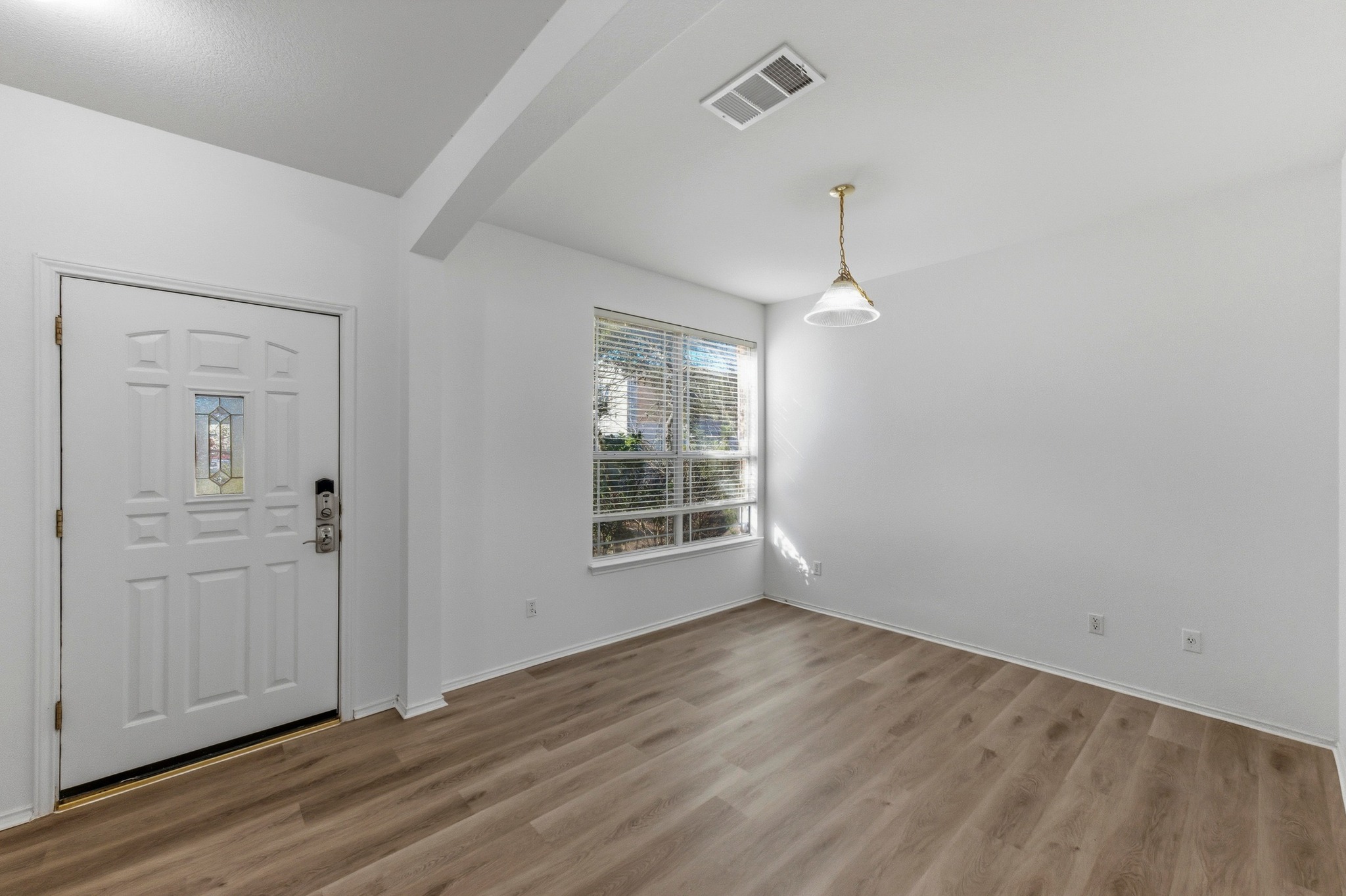 113 Spring Branch Cove Kyle, TX 78640 - Photo 4 of 33 Foyer featuring light wood-type flooring and beamed ceiling