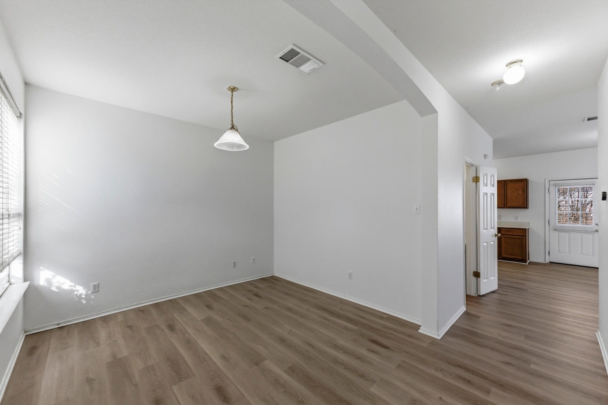 113 Spring Branch Cove Kyle, TX 78640 - Photo 5 of 33 Spare room featuring baseboards and wood finished floors