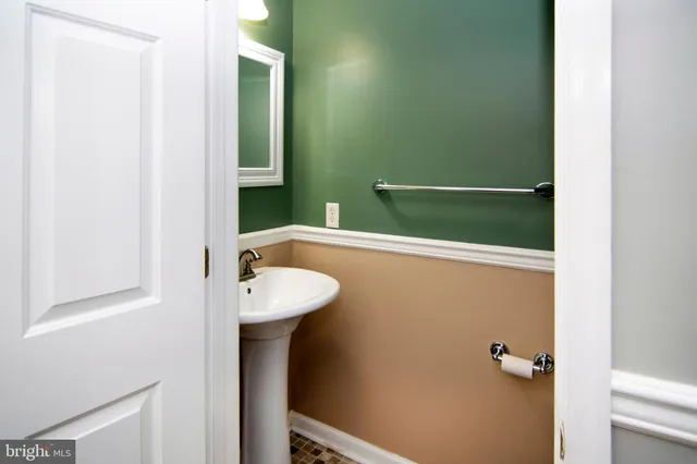 a bathroom with a sink and mirror
