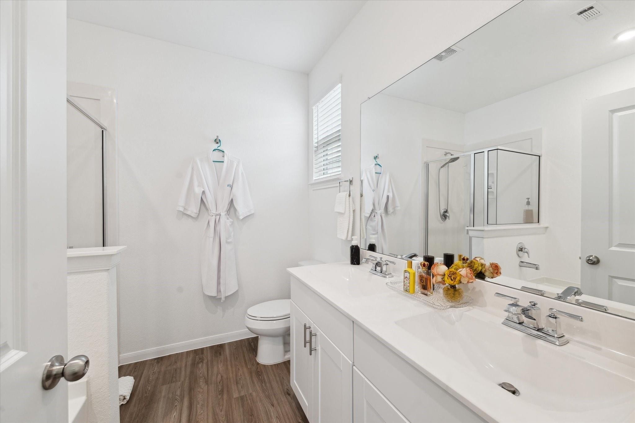 23502 Glenbuck St Spring Spring, TX 77373 - Photo 12 of 21 a bathroom with a sink toilet and shower