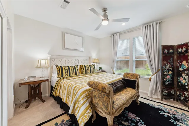 a bedroom with a bed and a couch