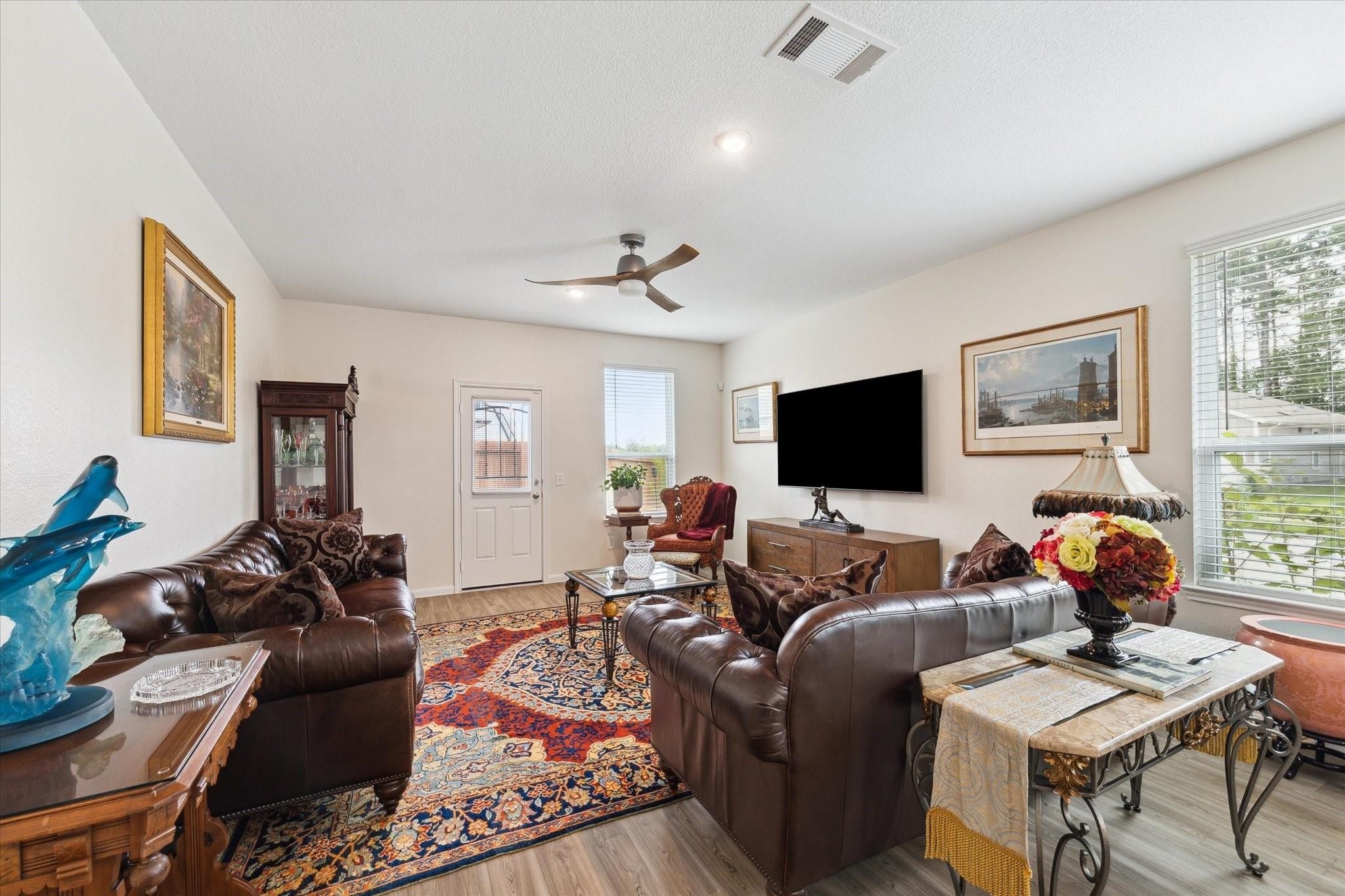 23502 Glenbuck St Spring Spring, TX 77373 - Photo 16 of 21 a living room with furniture and a flat screen tv