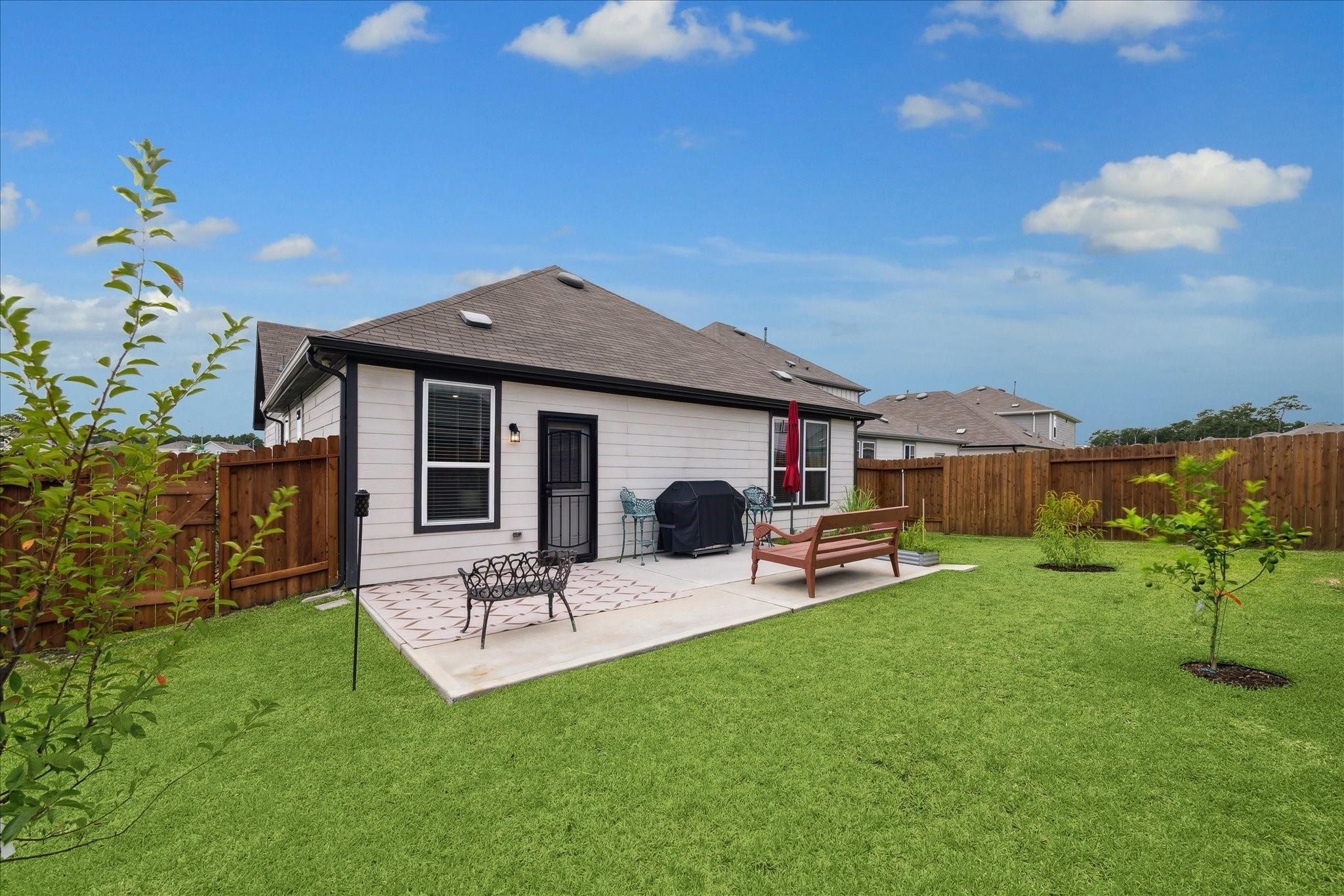 23502 Glenbuck St Spring Spring, TX 77373 - Photo 2 of 21 a front view of house with a garden and patio