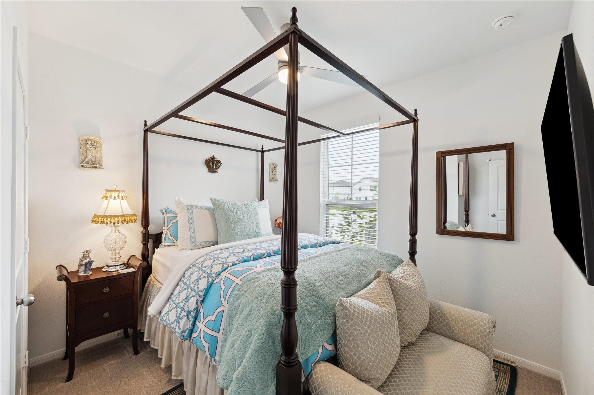 23502 Glenbuck St Spring Spring, TX 77373 - Photo 10 of 21 a bed room with a bed and a window