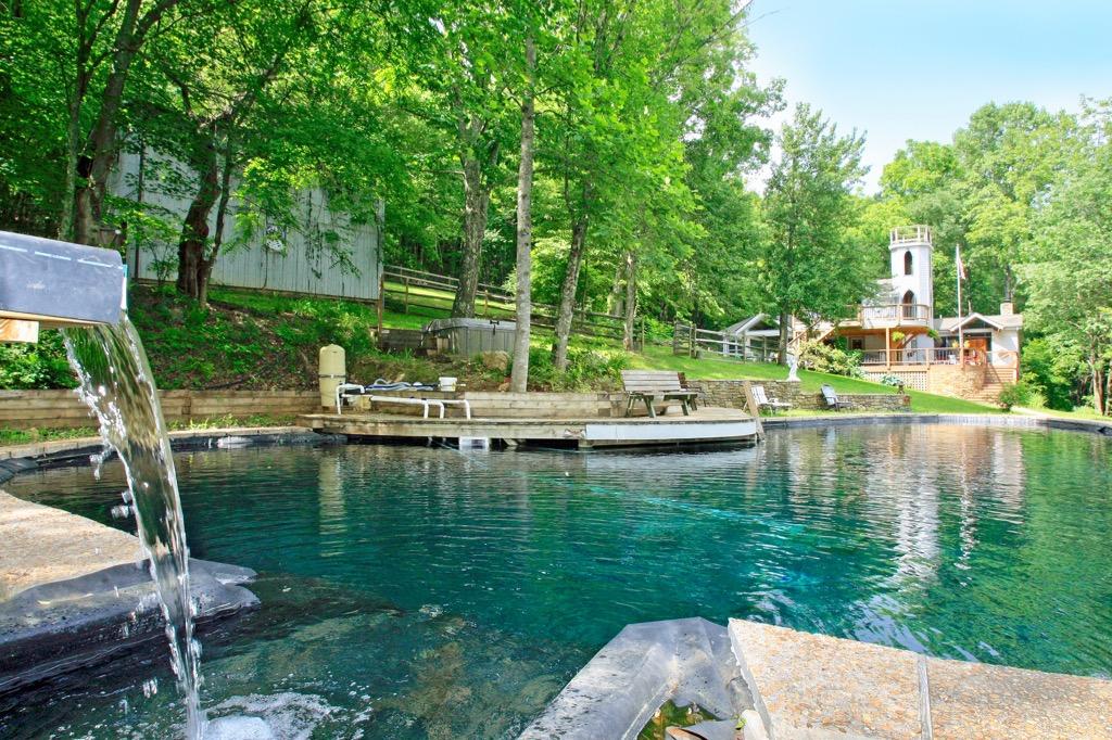 398 George Reed Lane Northwest Floyd, VA 24091 - Photo 2 of 61 a view of a lake with a house swimming pool and outdoor space
