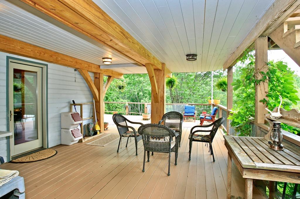 398 George Reed Lane Northwest Floyd, VA 24091 - Photo 45 of 61 a view of a patio with table and chairs and wooden floor