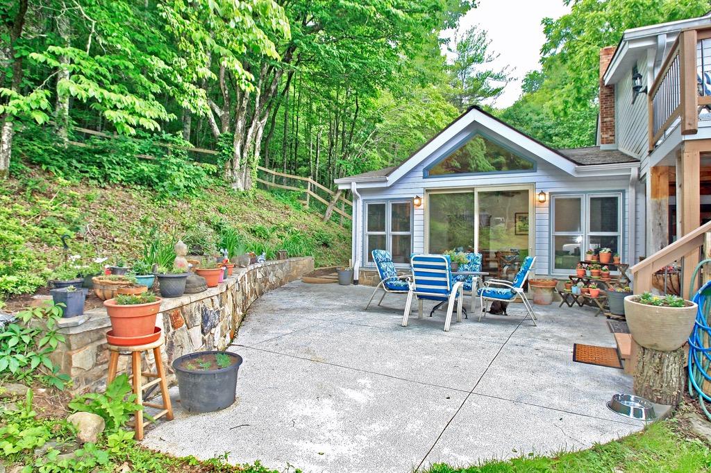 398 George Reed Lane Northwest Floyd, VA 24091 - Photo 50 of 61 a view of a patio with a table and chairs and potted plants