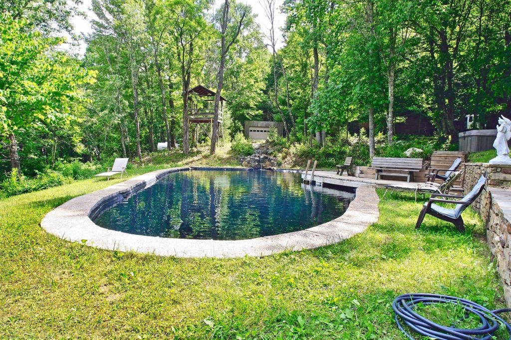 398 George Reed Lane Northwest Floyd, VA 24091 - Photo 52 of 61 a view of a swimming pool with a sitting space