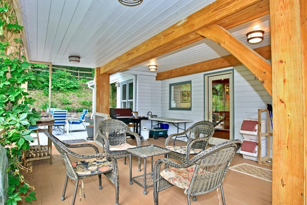 398 George Reed Lane Northwest Floyd, VA 24091 - Photo 54 of 61 a view of a patio with table and chairs and potted plants