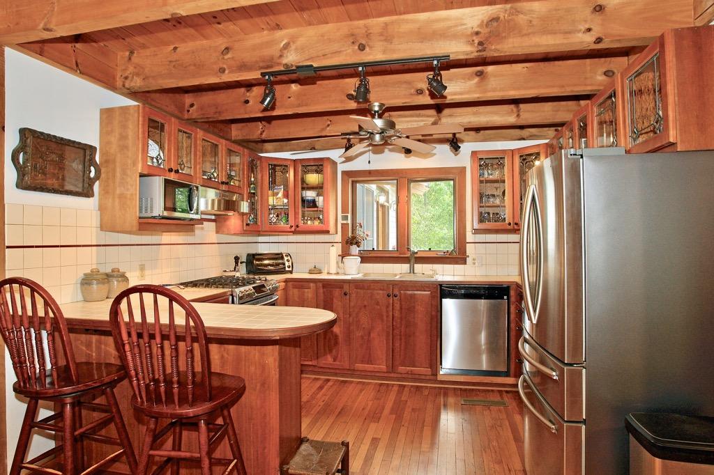398 George Reed Lane Northwest Floyd, VA 24091 - Photo 10 of 61 a kitchen with table chairs sink and wooden floor