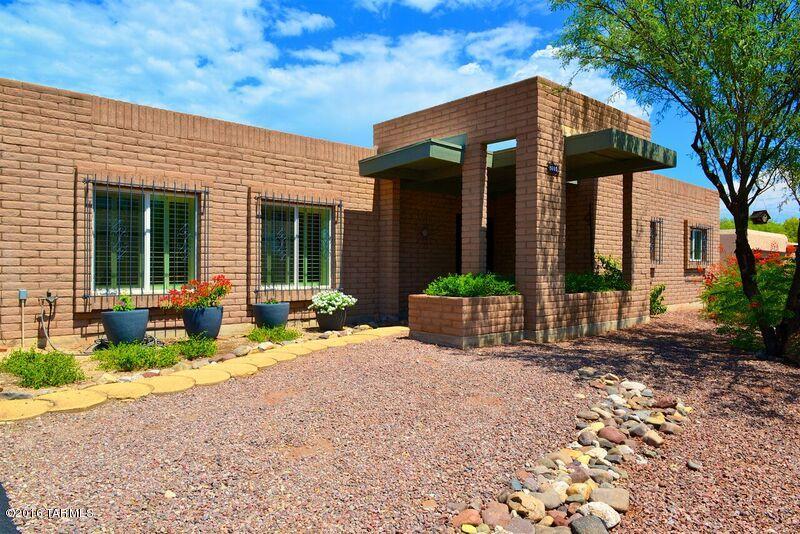 8001 East Presidio Road Tucson, AZ 85750 - Photo 3 of 25 a front view of house with yard and seating space