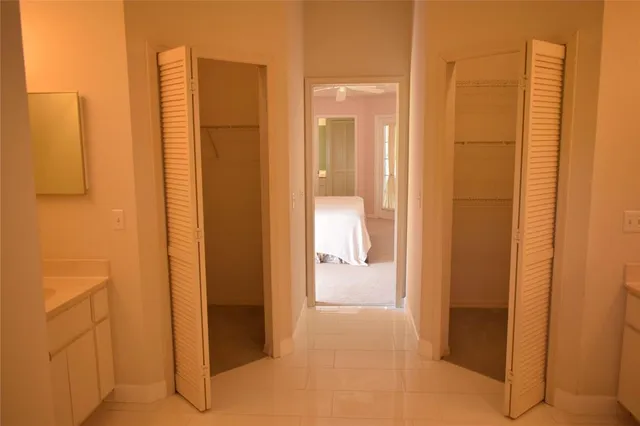 a bathroom with a toilet sink and vanity