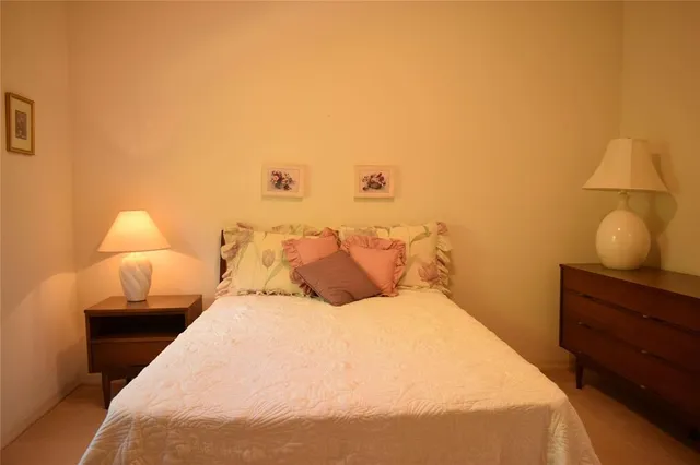 a bathroom with a window and a shower