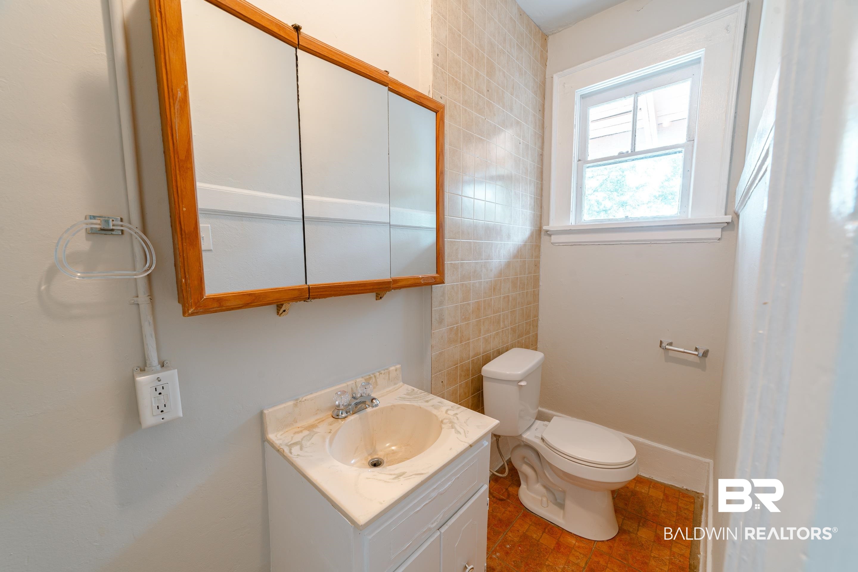 312 1st Street Mobile, AL 36611 - Photo 20 of 29 Bathroom featuring tile walls, vanity, and toilet