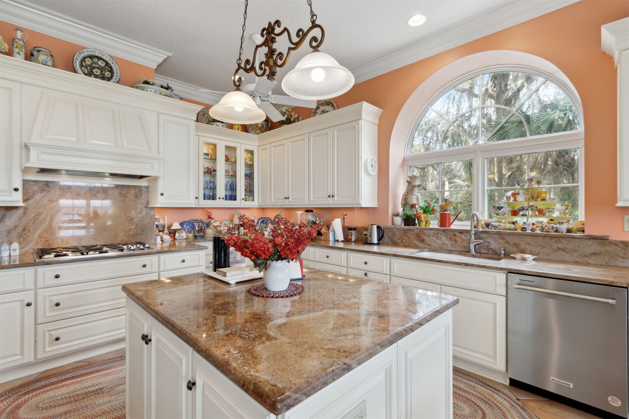 76 Marsh Creek Road Amelia Island, FL 32034 - Photo 14 of 100 a kitchen with stainless steel appliances granite countertop a sink a stove and a wooden floors