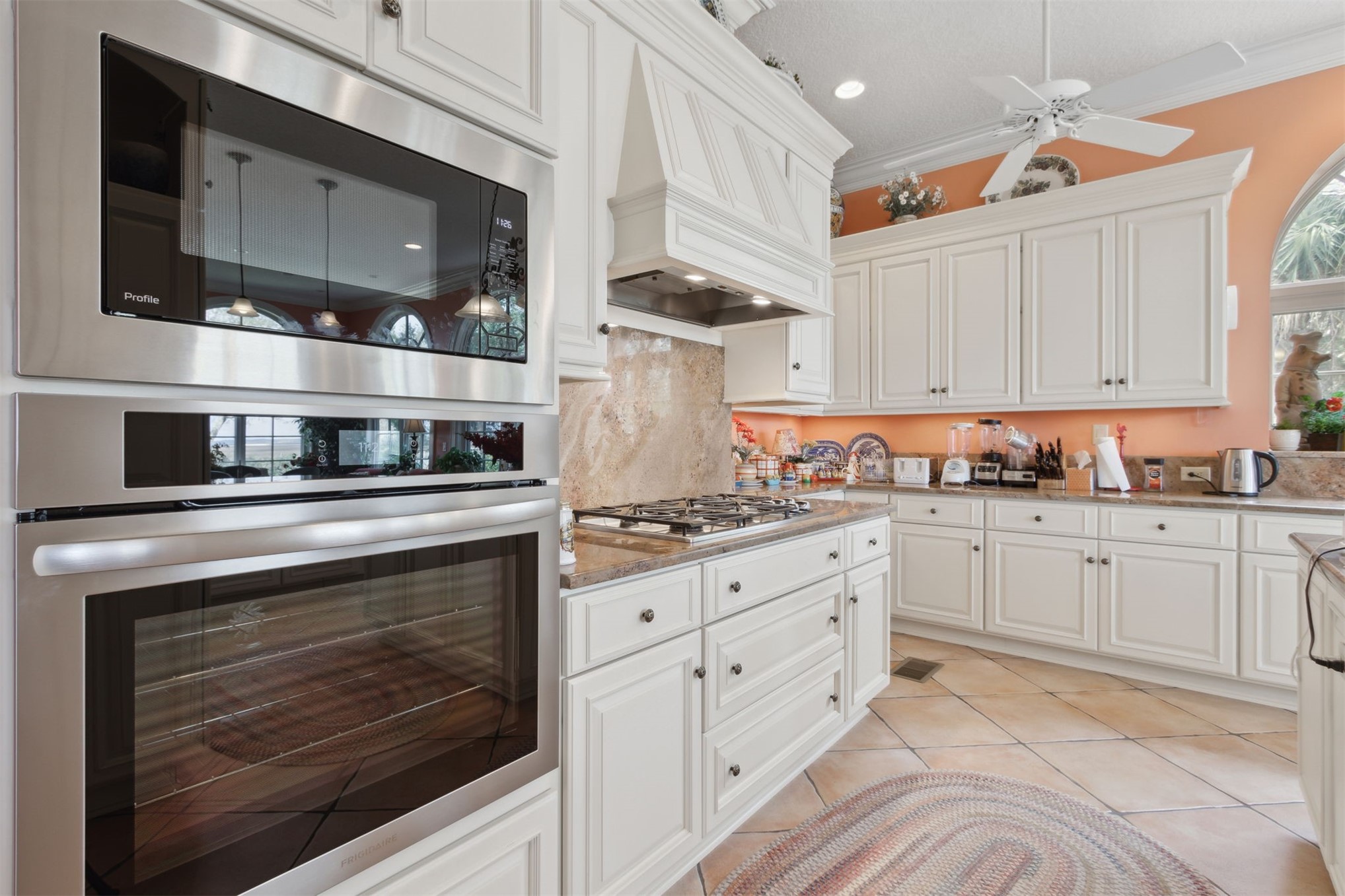 76 Marsh Creek Road Amelia Island, FL 32034 - Photo 22 of 100 a kitchen with stainless steel appliances granite countertop a stove and a microwave