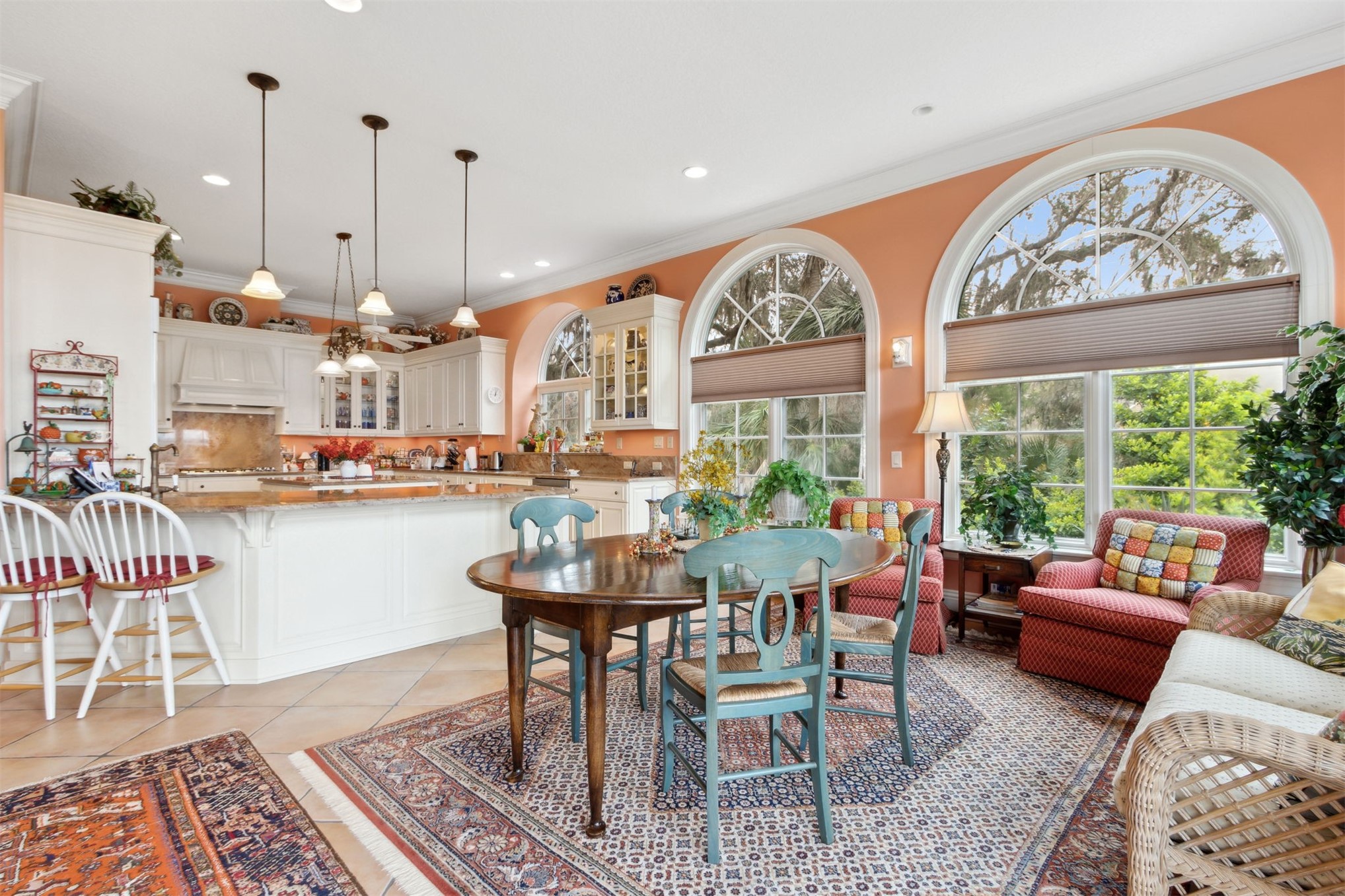 76 Marsh Creek Road Amelia Island, FL 32034 - Photo 23 of 100 a dining room with furniture a rug and a floor to ceiling window