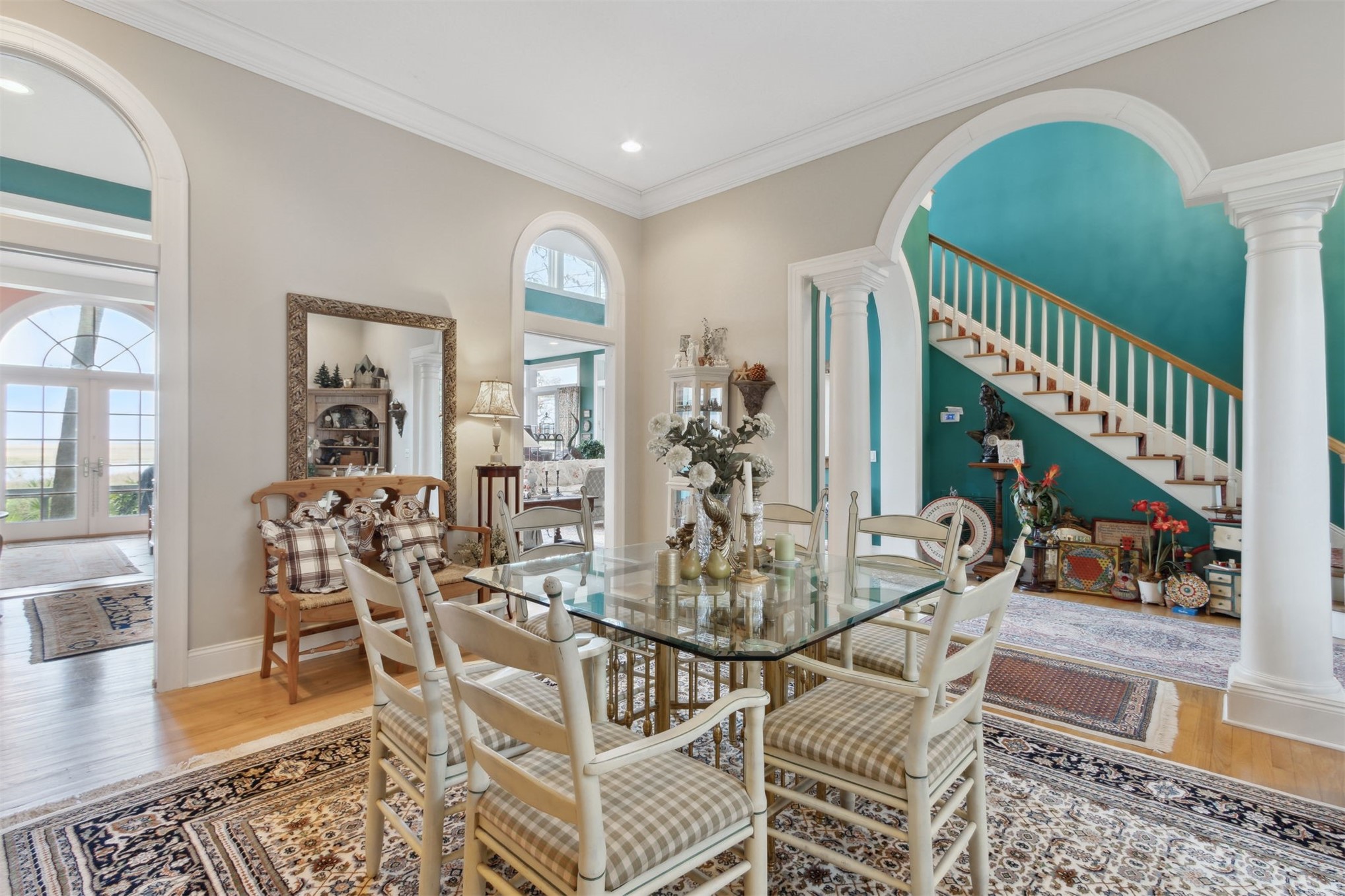 76 Marsh Creek Road Amelia Island, FL 32034 - Photo 36 of 100 a view of a dining room and livingroom with furniture wooden floor a rug and a chandelier